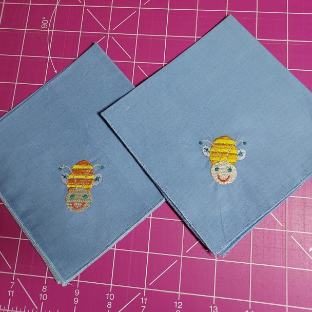 https://www.organic-ally.co.uk/ embroidered Happy Bee hankie on blue organic cotton lawn